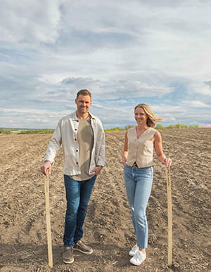 Brady and LIndsay Funk in a field 