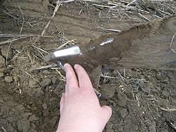 Soil remaining on air seeder opener