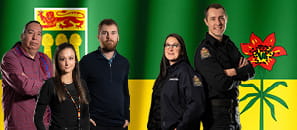 Correctional Service Employees standing in front of Saskatchewan Flag
