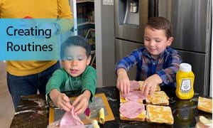 Two children make sandwiches
