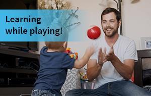 Dad and son playing with ball