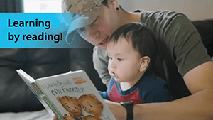 Father reading to son