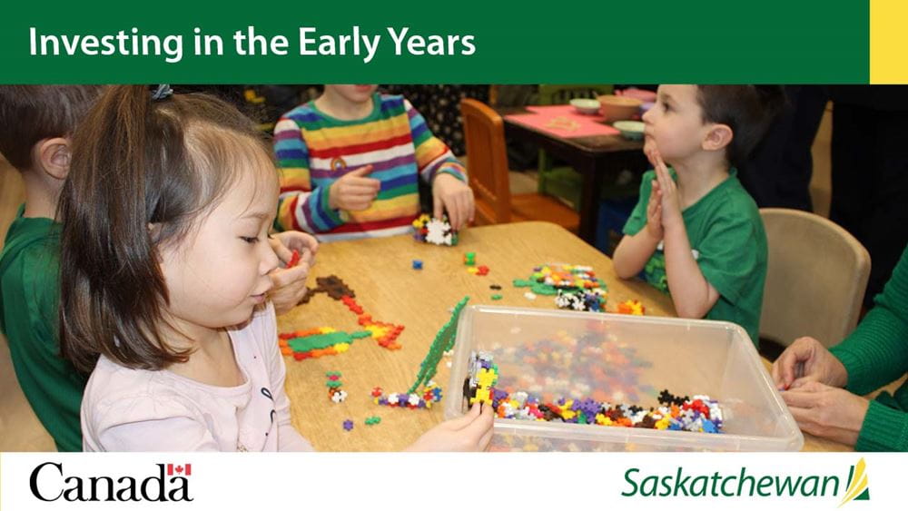 Investing in the early years. A child plays Lego at a table.