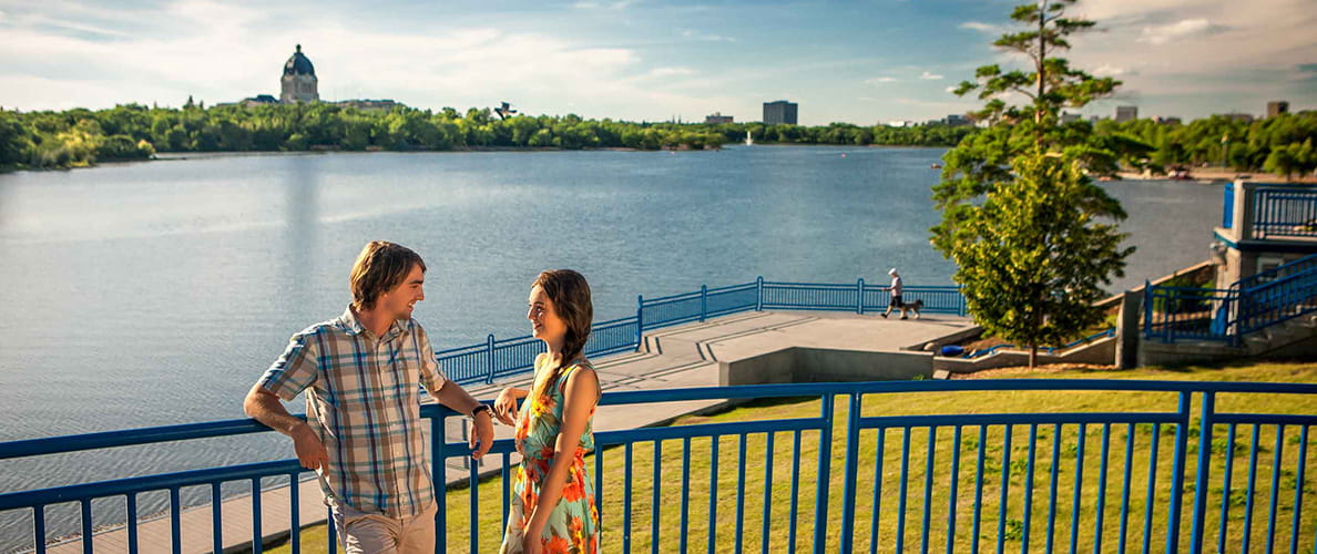 Couple at Wascana Lake with Legislative Building in background
