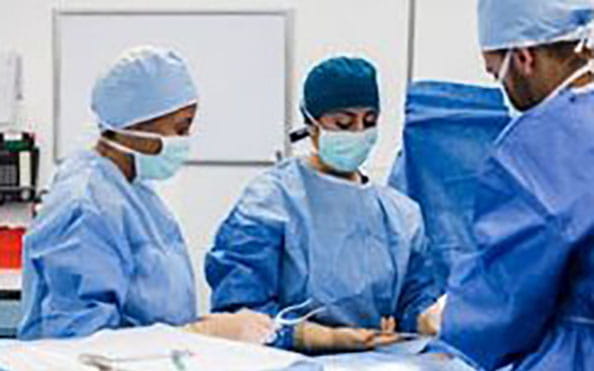 Health professionals in an operating room