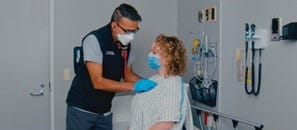 Dr. Kapur, an Emergency Physician in Saskatoon consulting patient