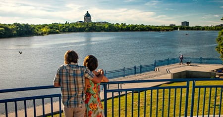 Two people looking at the view at Wascana Lake in Regina