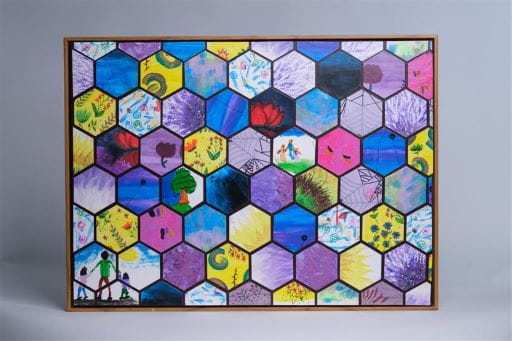 Framed art work that is a colourful collage of octagon's with individual art work depicting personal hope and healing.