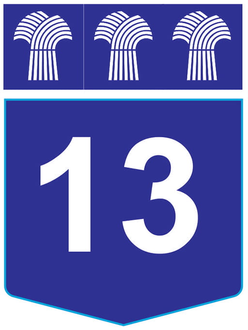 A Highway 13 route marker which has the number in white and the background in blue.