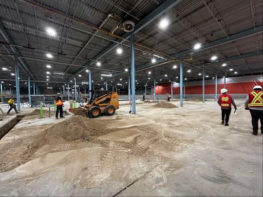 Construction photo showing crews and equipment at work at the new Research, Exhibits and Collection Facility.